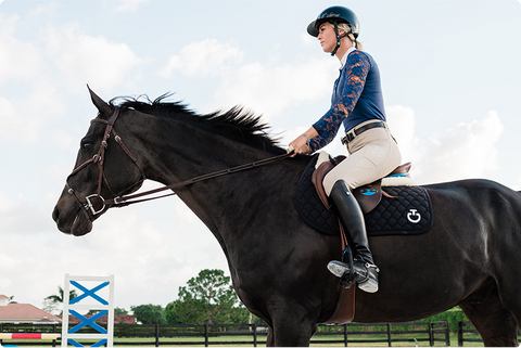 An English-style horse and rider in the Redmond equine affiliate program for athletes.